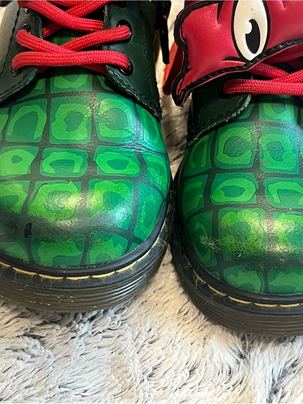 Dr. Martens Kids Green Croc-Pattern Boots with Red Eye Accent - Picture 8 of 8